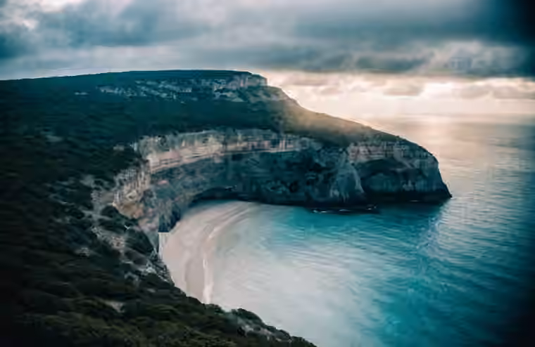A cliff-edge bay on Nusa Penida seen from above